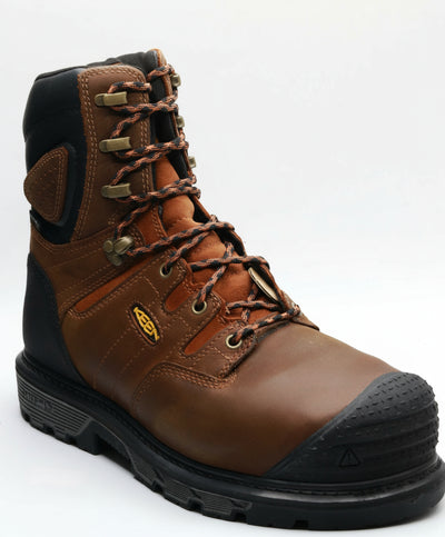 Brown work boot with black sole on a white background