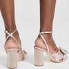 Loeffler Randall Women's Camellia Pleated Knot Heeled Sandals with Ankle Strap, Champagne, Gold, Metallic, 8.5 Medium US